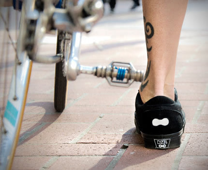 On-foot shot of black Minna casual cycling shoes showing fit and street style