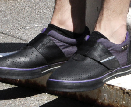 Purple clipless cycling shoes on foot, casual cycling shoes showing style and SPD compatibility