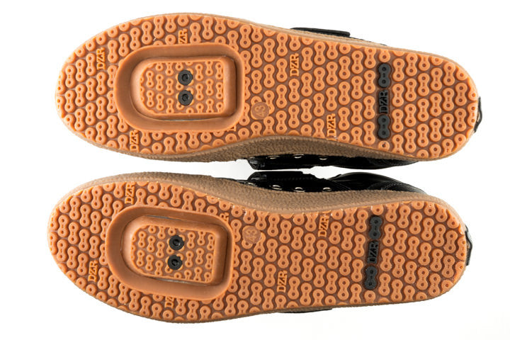 Close-up of Marco Black mtb shoes natural gum rubber and link traction outsole for grip on varied surfaces