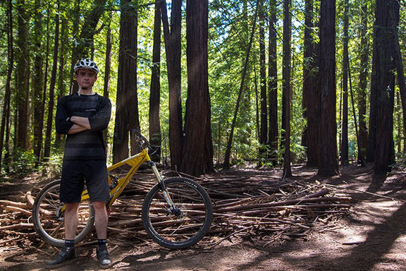Marco Black clipless cycling shoes worn on a dirt trail, highlighting rugged casual cycling shoe silhouette and traction sole

