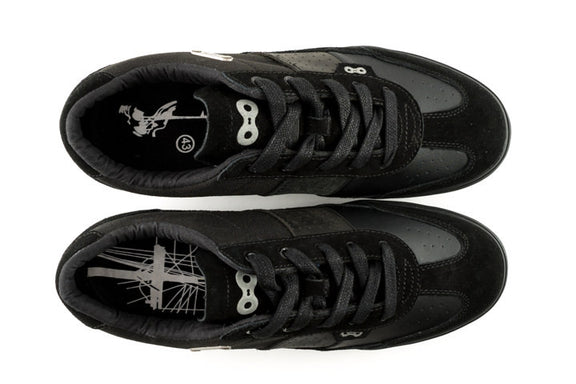 Top view of Minna clipless cycling shoes with elastic lace catch and reflective heel badge