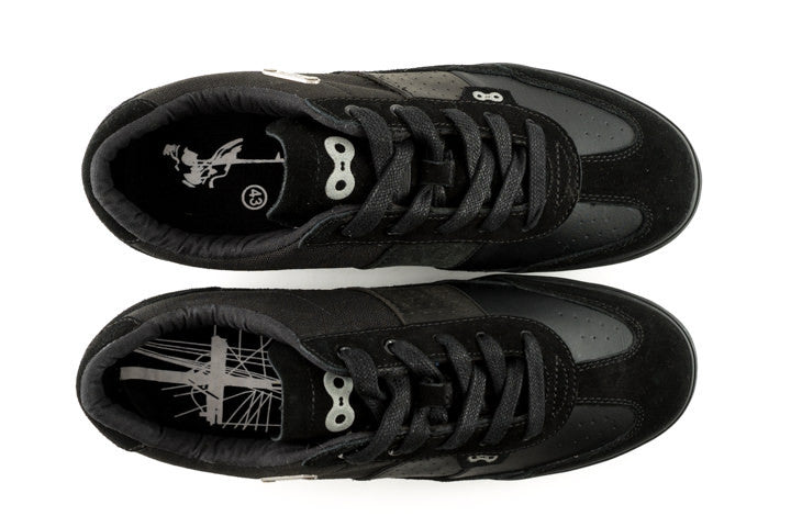Top view of Minna clipless cycling shoes with elastic lace catch and reflective heel badge