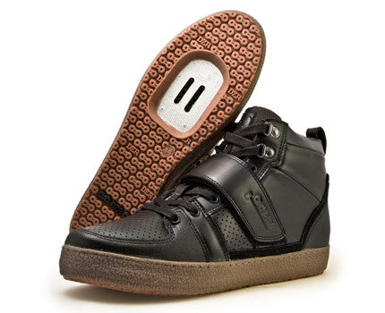 Asymmetrical protection detail on Marco Black clipless cycling shoe providing ankle protection on rugged trails


